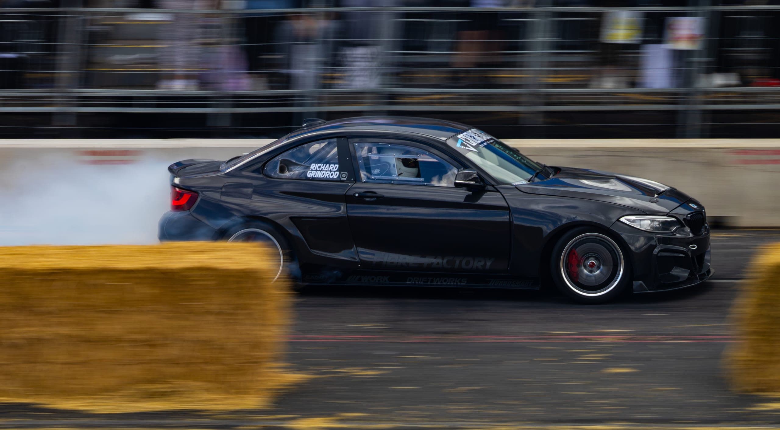 A drift car in clean side profile mid-run, Gravity 2026