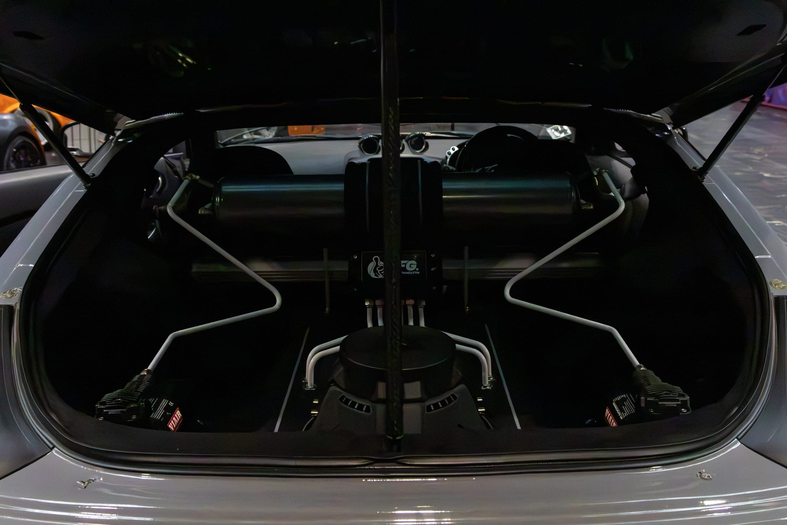 An engine bay intake in low light, Gravity 2026
