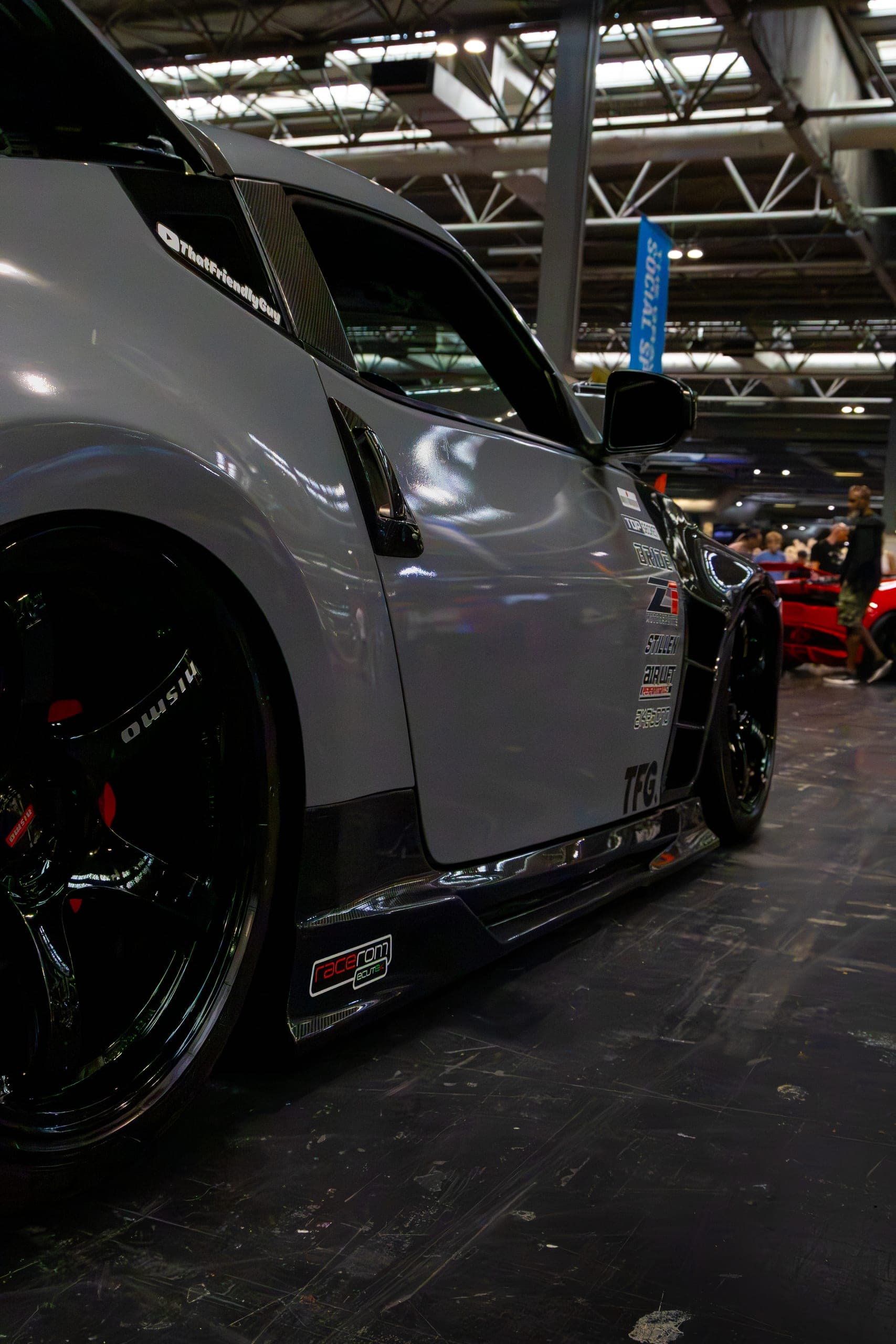 A front arch and wheel on a white show car, Gravity 2026