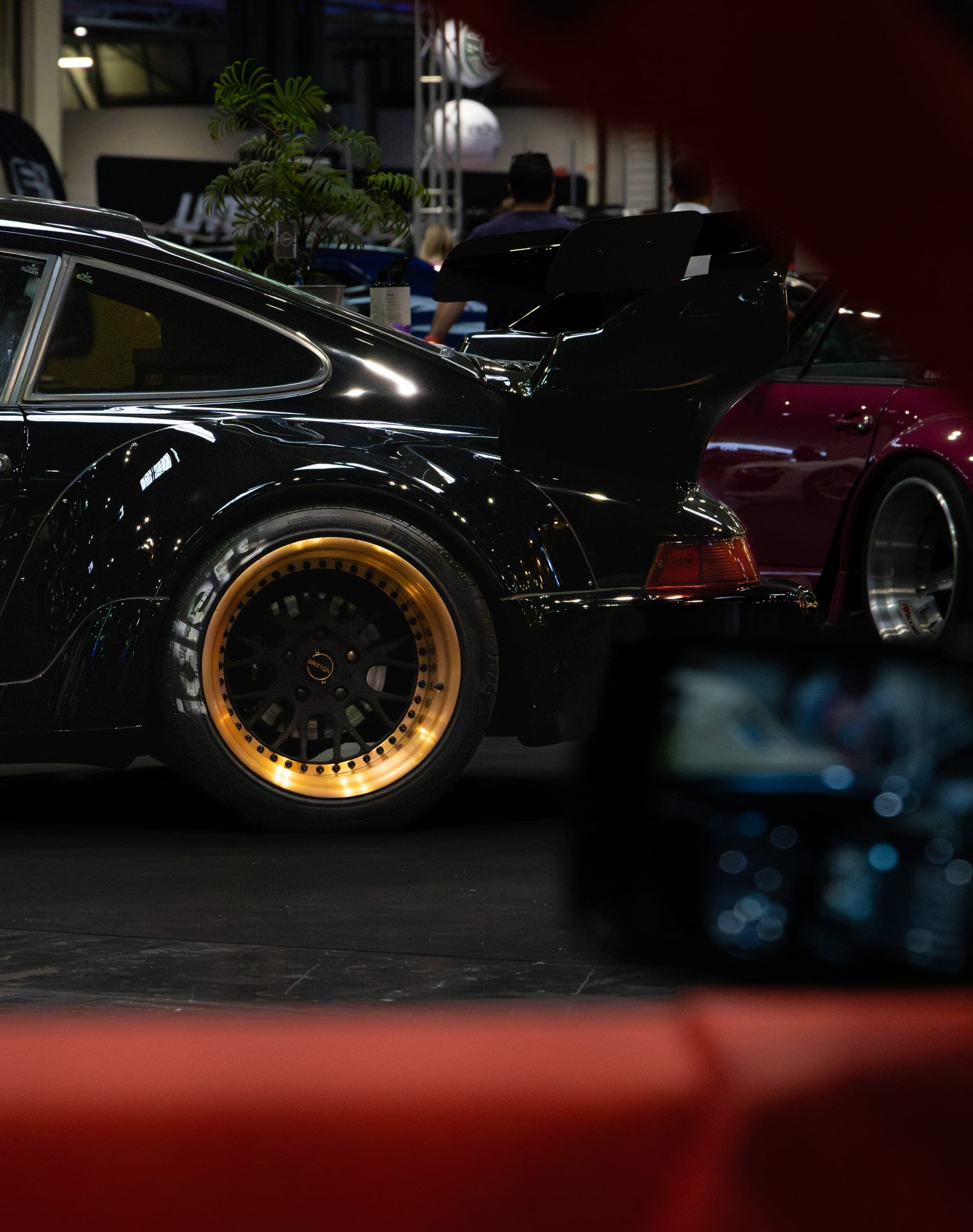 A widebody show car sitting low on gold wheels, Gravity 2026