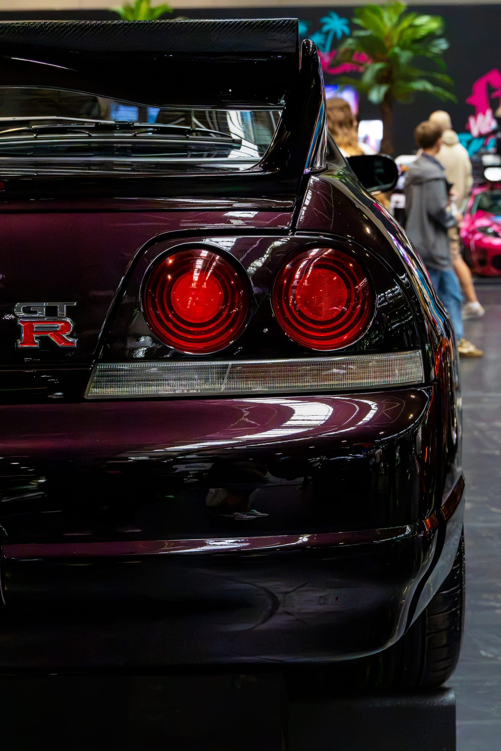 Round tail lights on a dark Japanese coupe, Gravity 2026