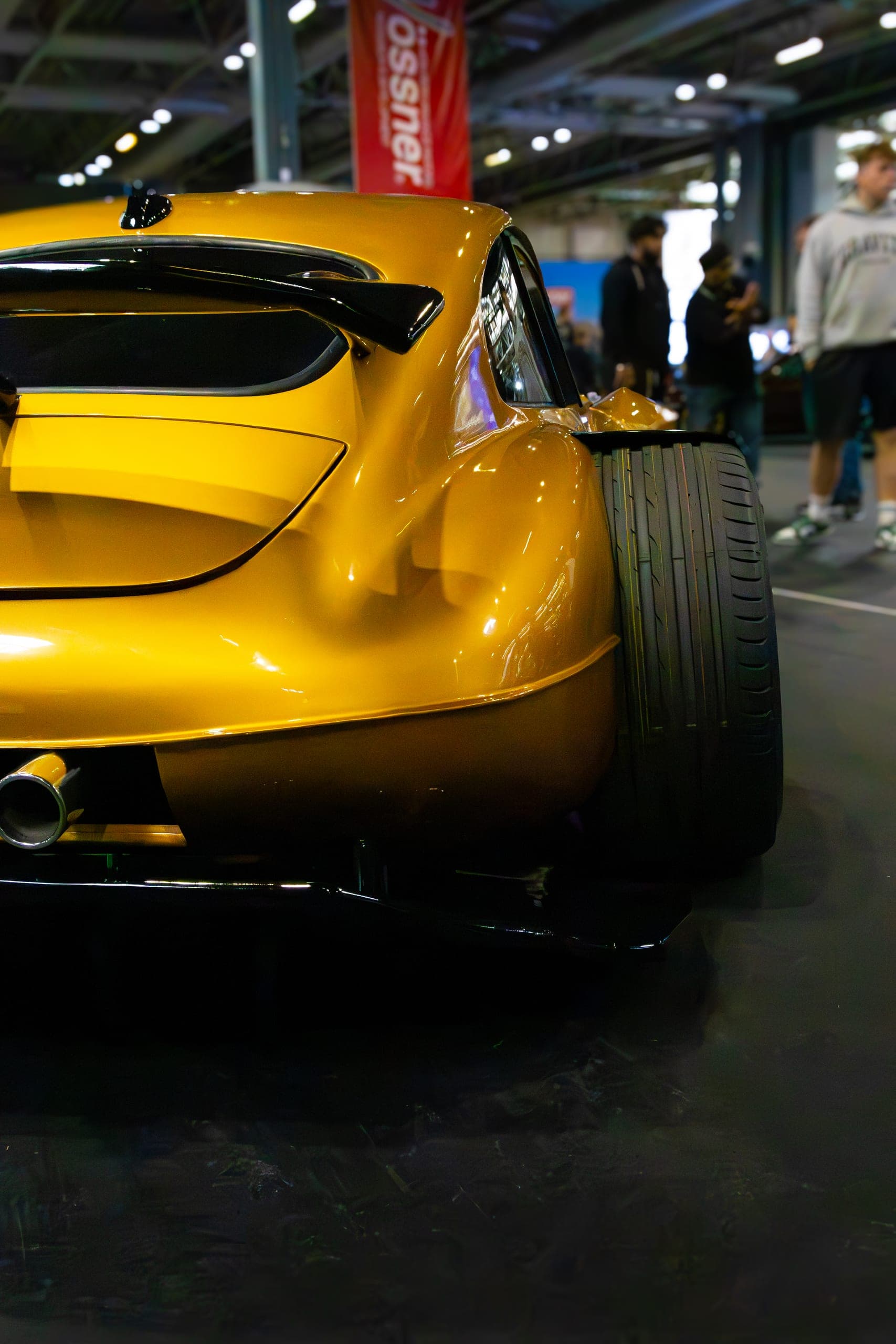 The rear quarter of a yellow show car, Gravity 2026